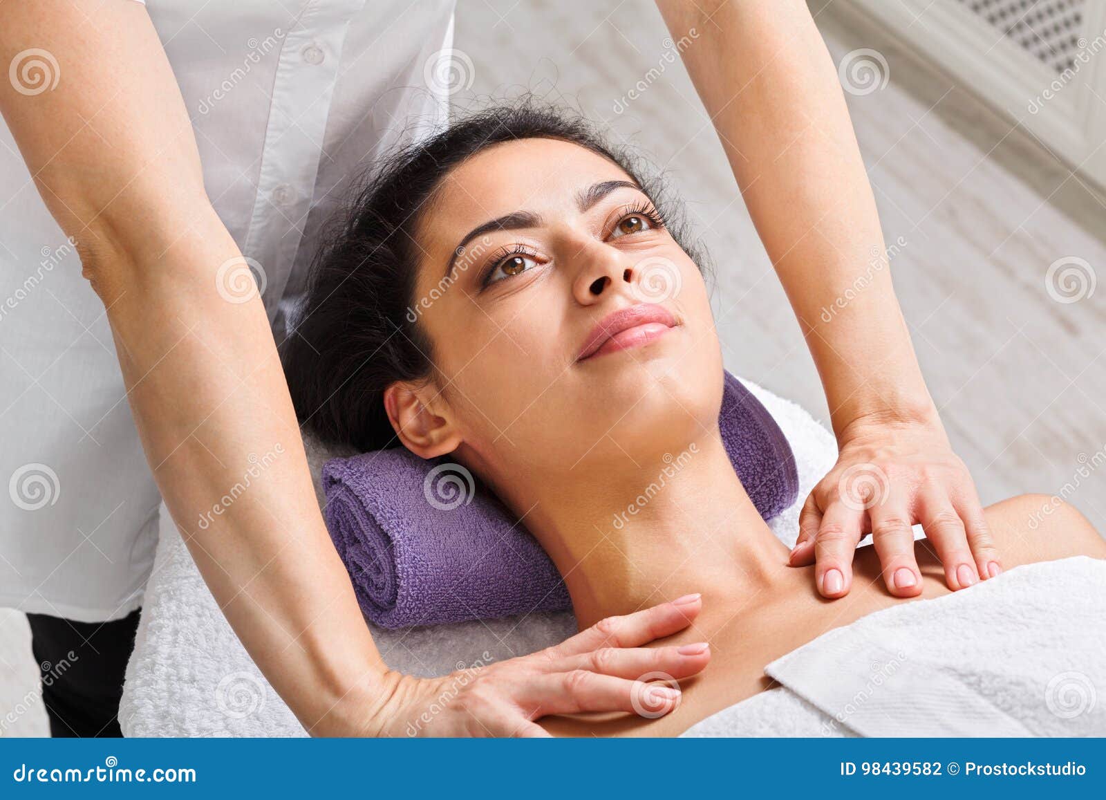 Woman Beautician Doctor Make Neck Massage In Spa Wellness Center Stock