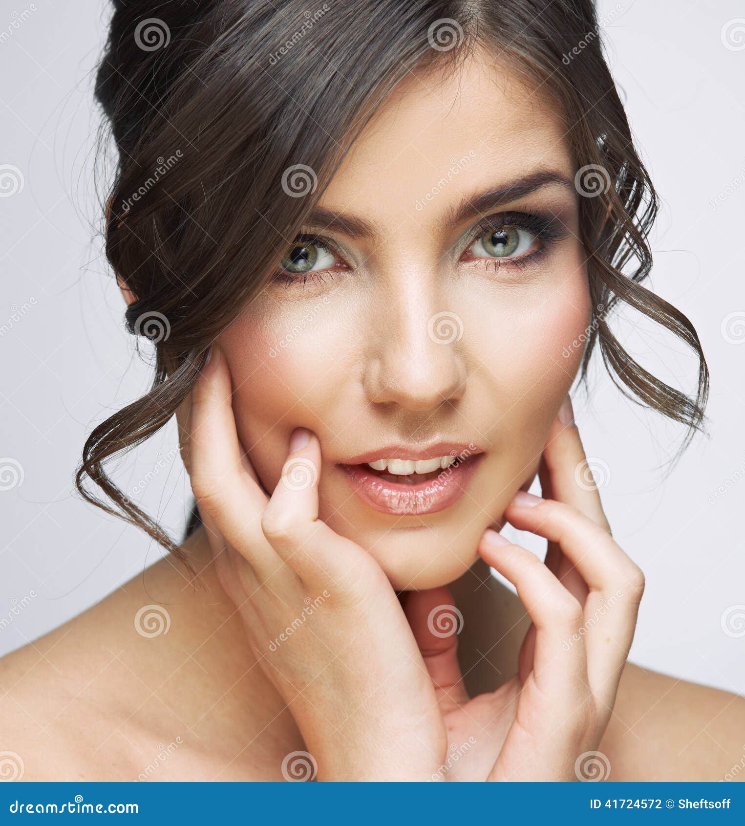 beautiful stylish young woman covering face with hand and posing isolated  on coral Stock Photo - Alamy