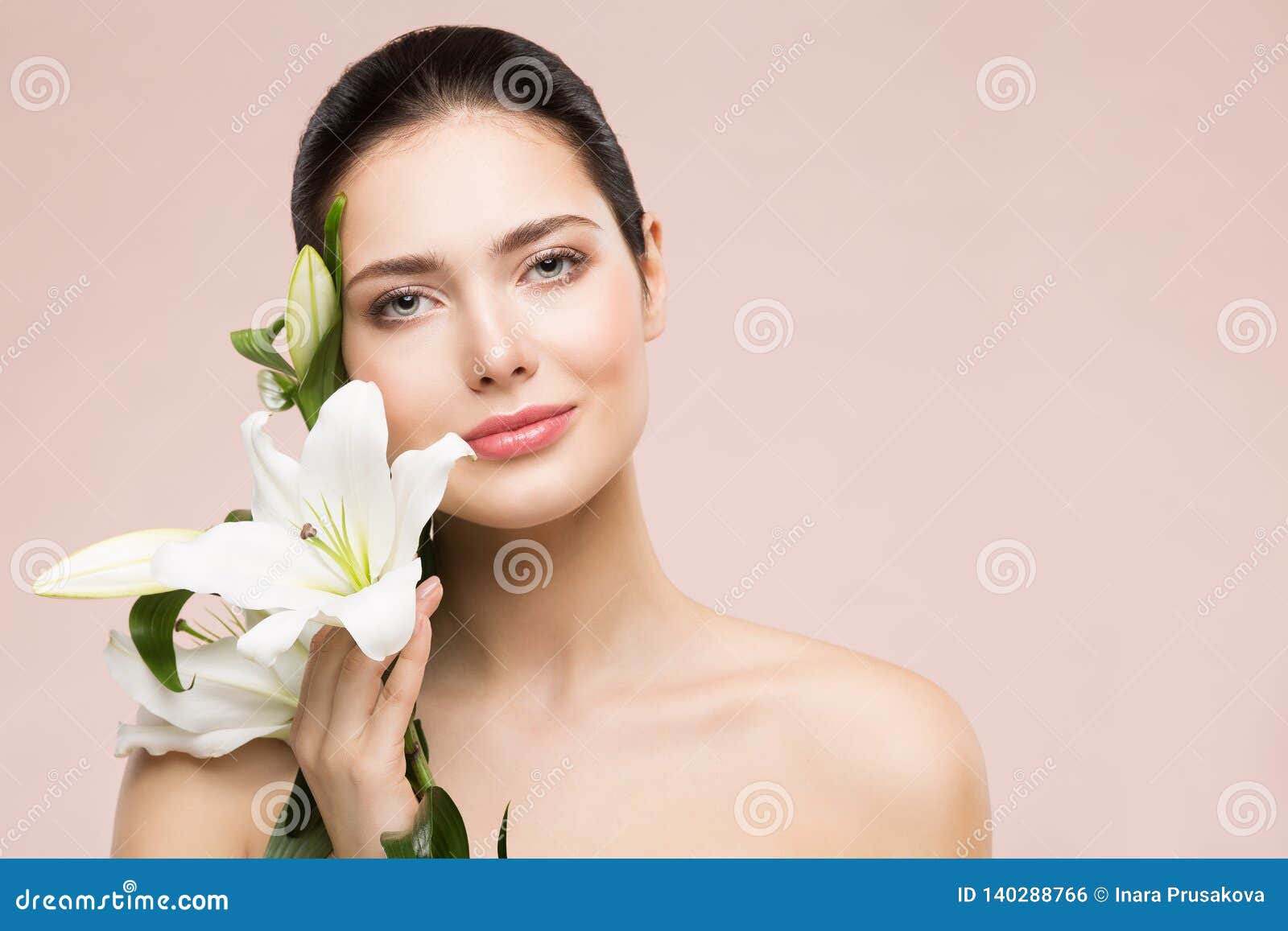woman beauty natural makeup portrait with lily flower, happy girl face skin care and treatment