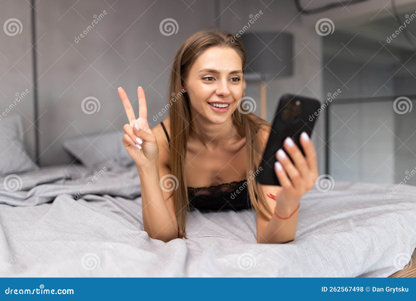 Clips App Saxy Videos - Woman in Bed Checking Social Apps with Smartphone. Woman Making Video Call,  Lying on Bed in the Morning Stock Photo - Image of lady, chat: 262567498