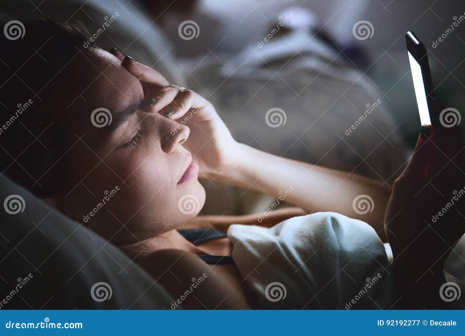 Woman on Bed with Phone, Headache Stock Image Image of technology