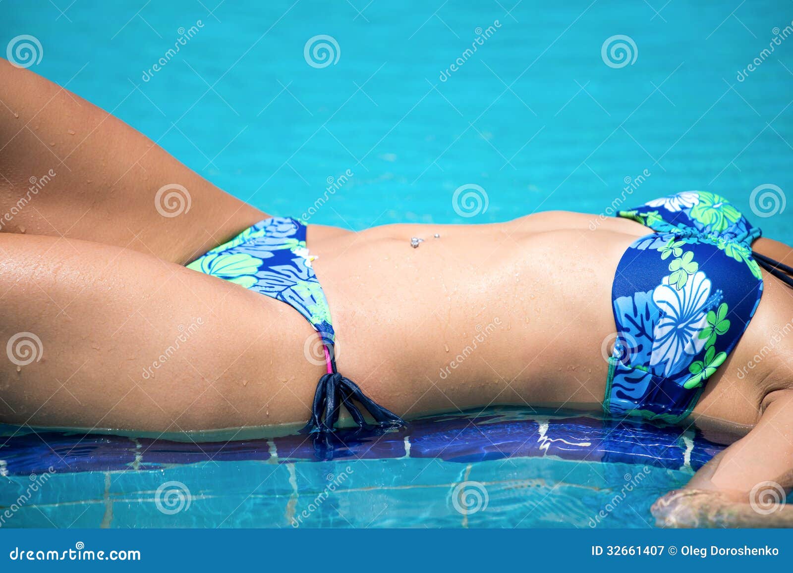 Woman Belly on the Swimming Pool Stock Image - Image of closeup