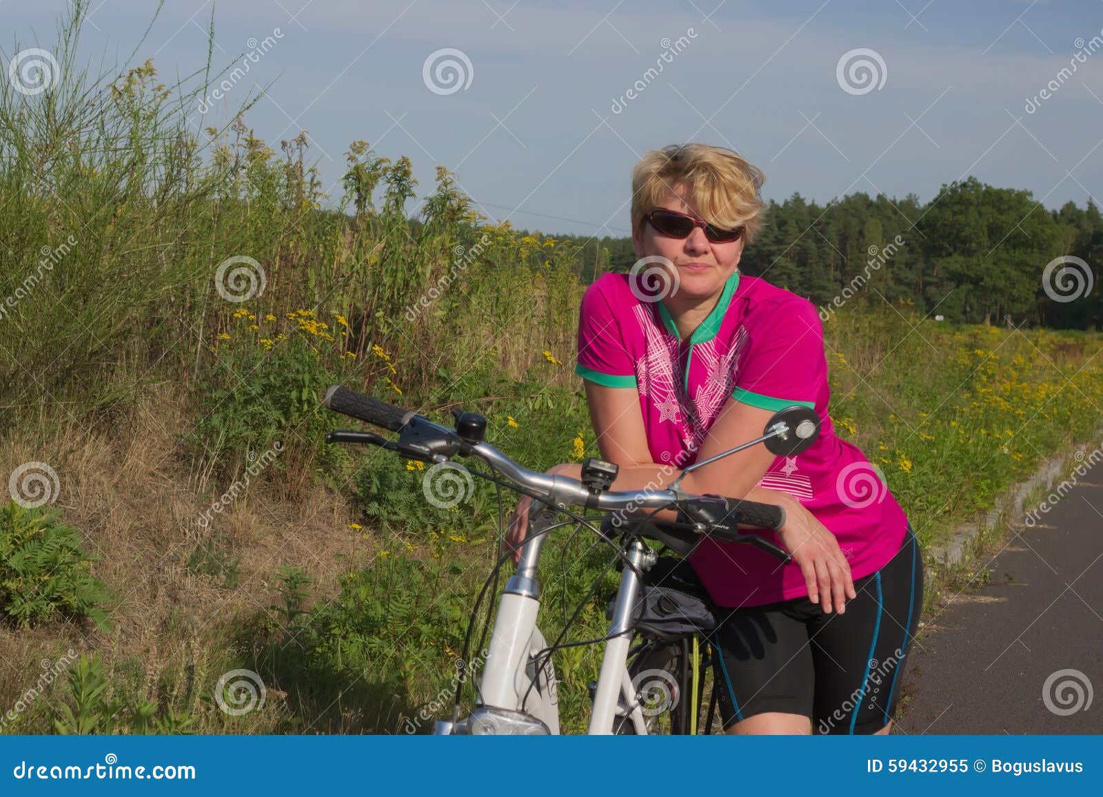 a woman with a bicycle.