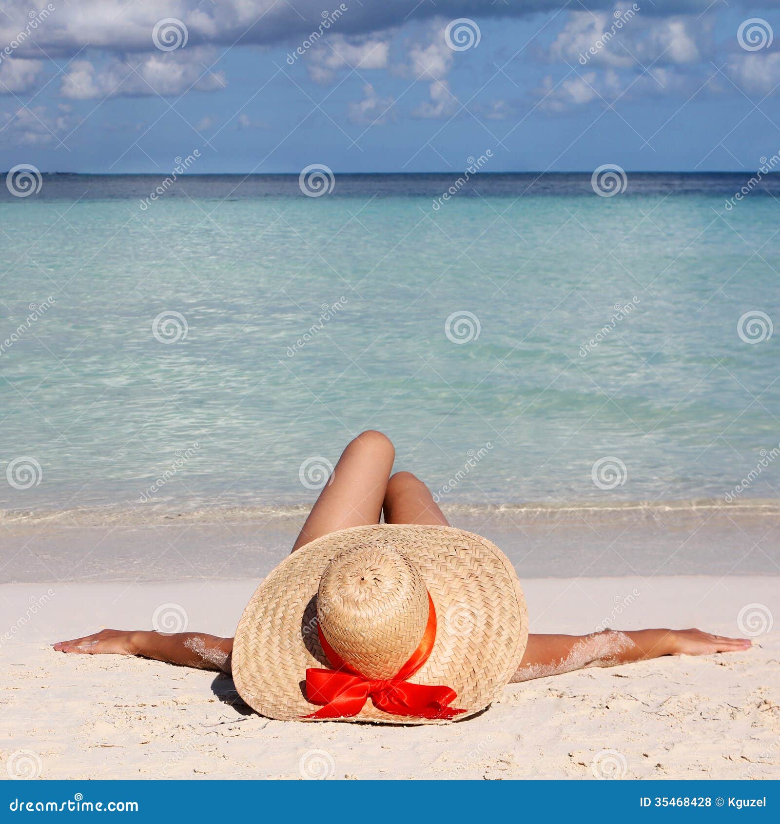 Woman in Big Sun Hat from Relaxing on Tropical Beach. Stock Photo