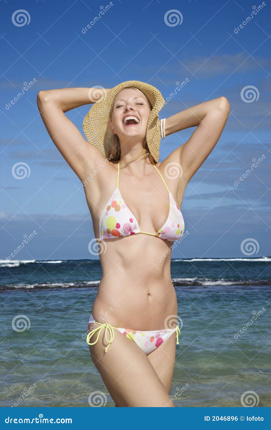 Woman in bikini on beach stock photo