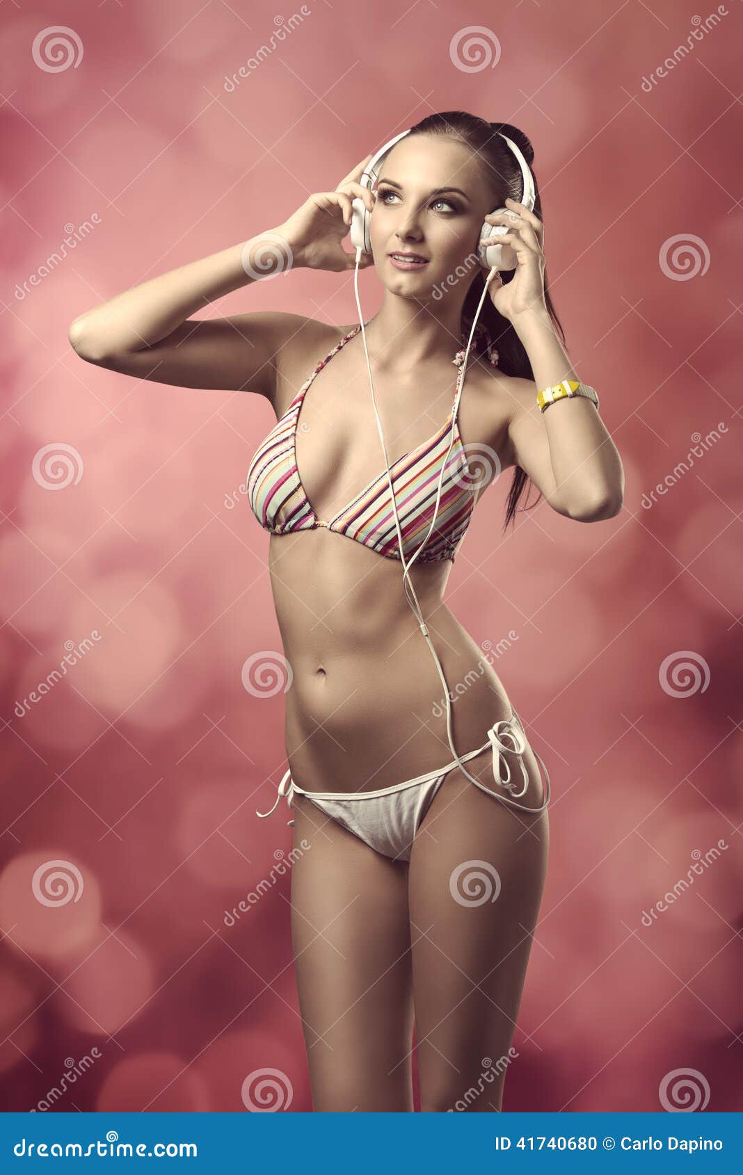 Woman in Bikini Listening Music Stock Photo