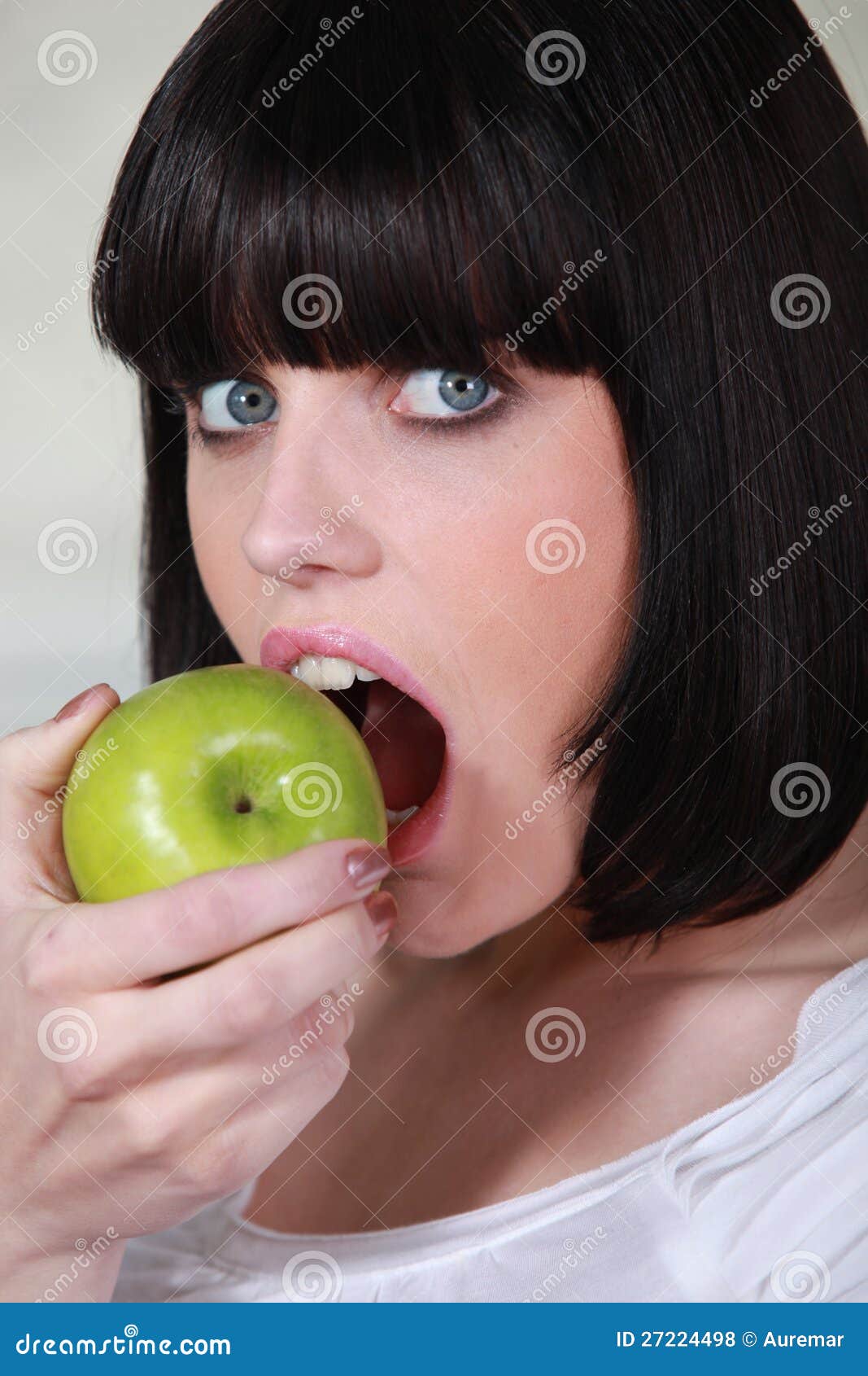 Woman biting apple stock photo. Image of angle, everyday - 27224498