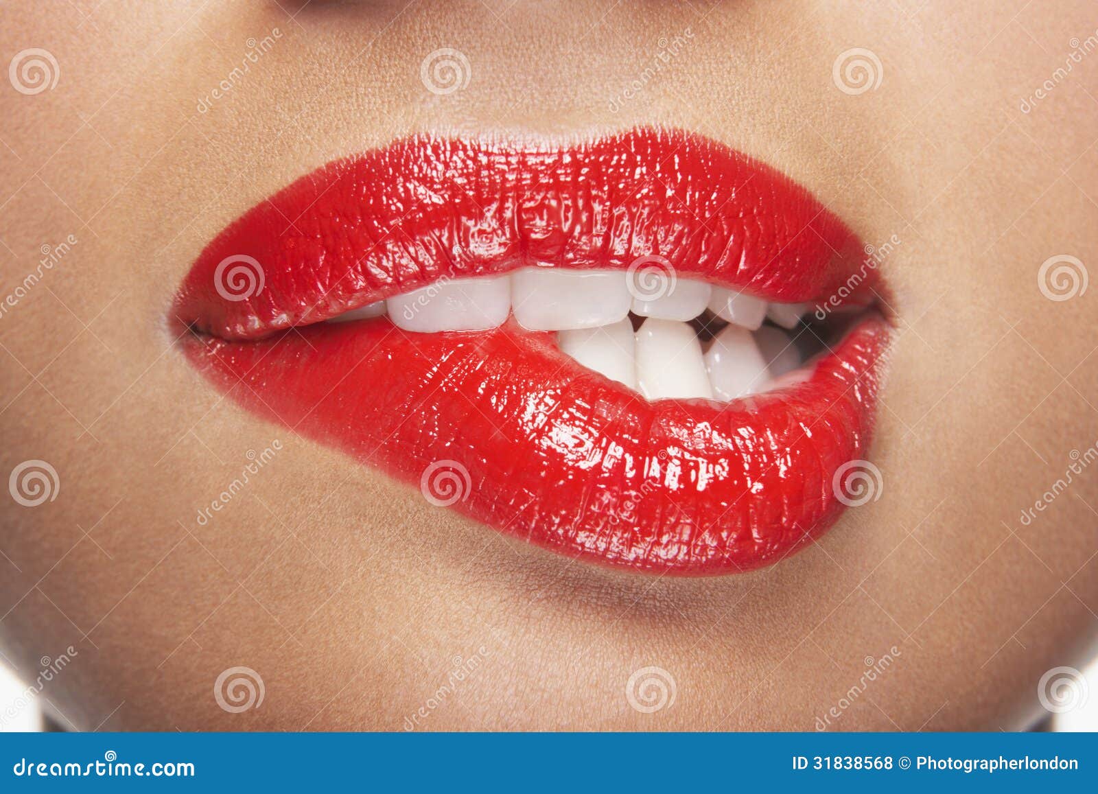 woman biting red lips