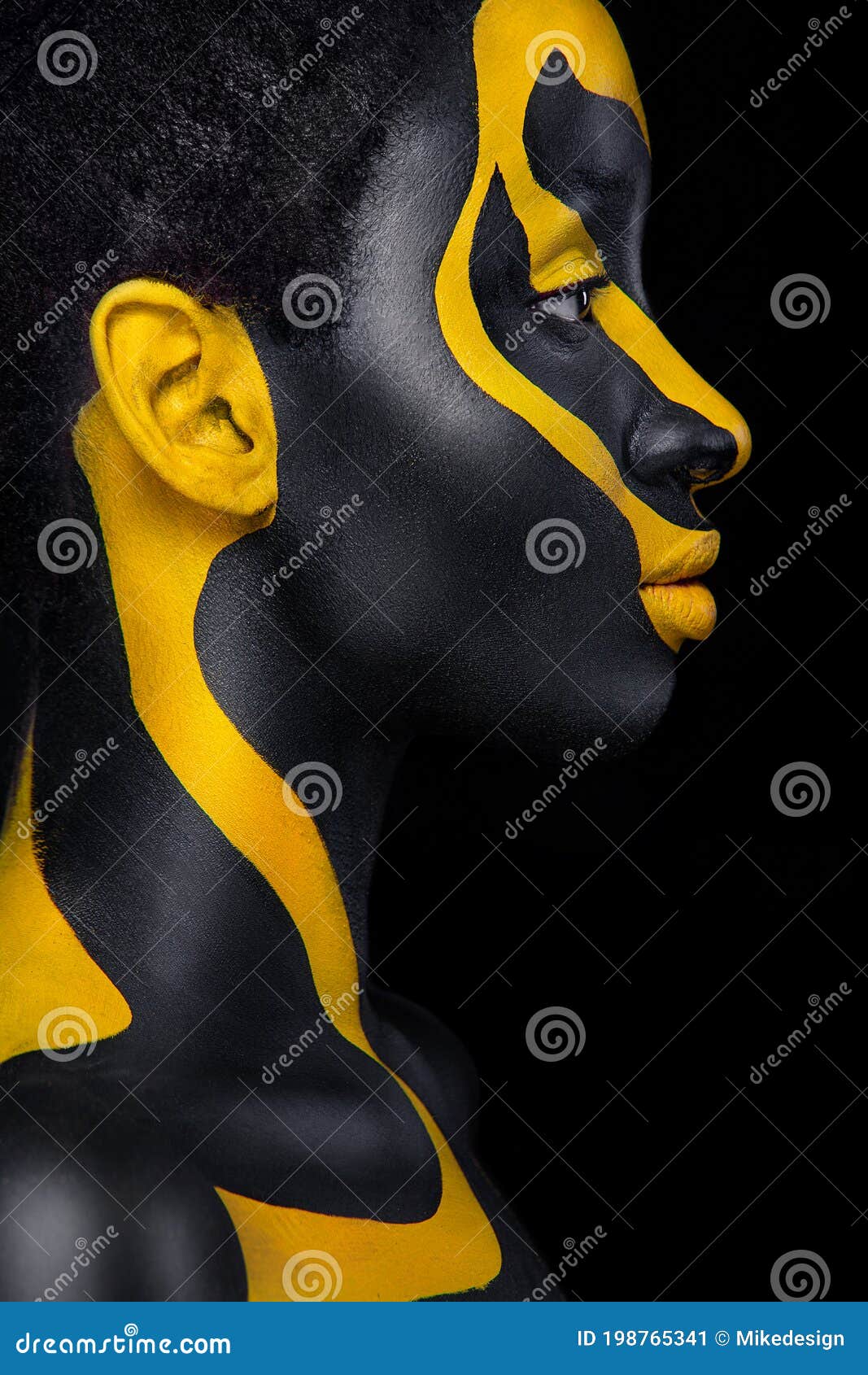 Yellow and black body paint. Woman with face art. Young girl with