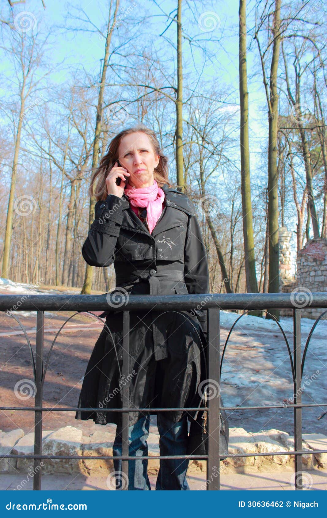 A Woman In A Black Coat Talking On A Mobile Phone Stock Photo - Image ...