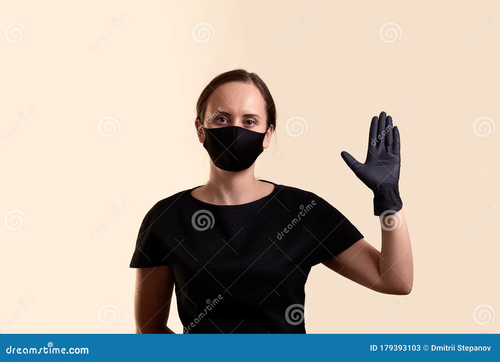 Woman in Black Dress Face Mask and Gloves Shows a Palm As a Greeting ...