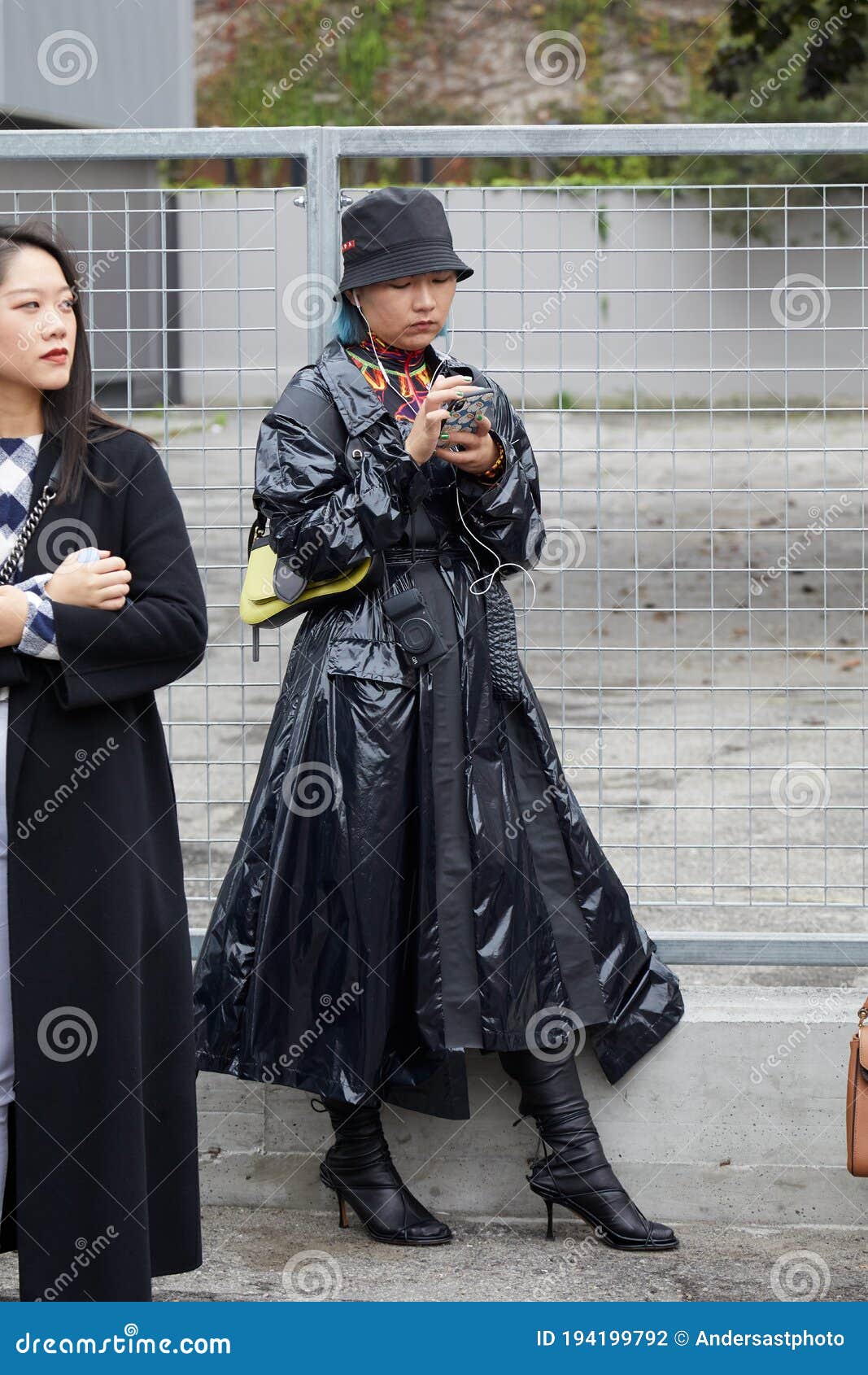 Woman with Black Raincoat and Prada Hat before Fila Fashion Show, Milan  Fashion Week Street Editorial Photography - Image of outfit, smartphone:  194199792