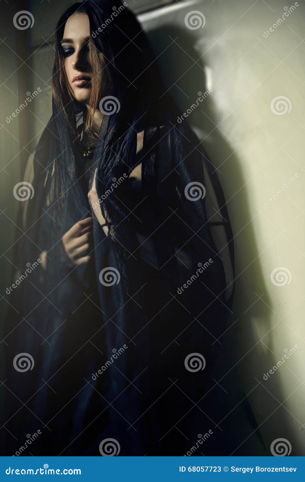 Woman in a Black Robe at Green Wall Stock Image - Image of femininity