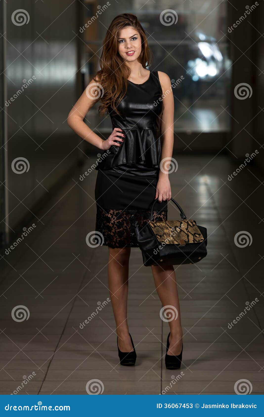 Woman In Black Skirt And Leather Peplum Top Stock Image 