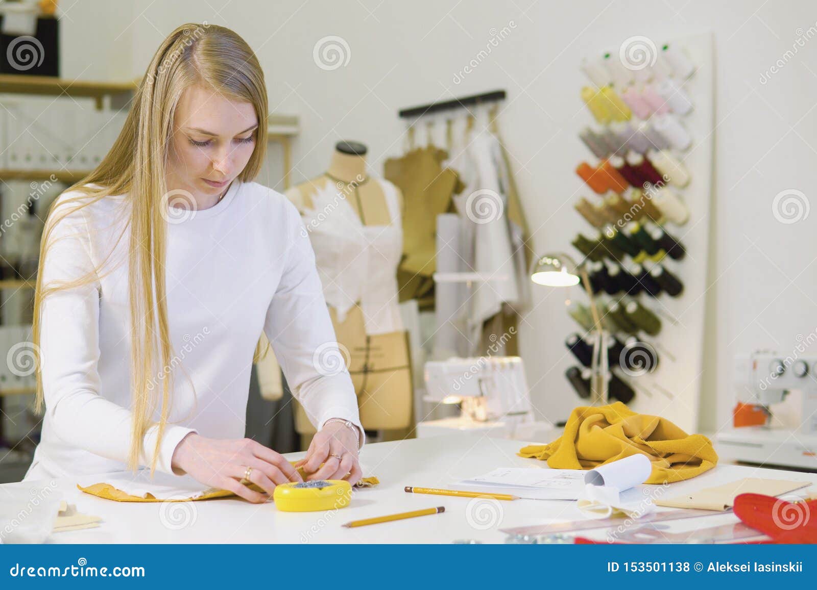 Woman with Blond Hair - Freelancer, Fashion Designer or Tailor Working ...