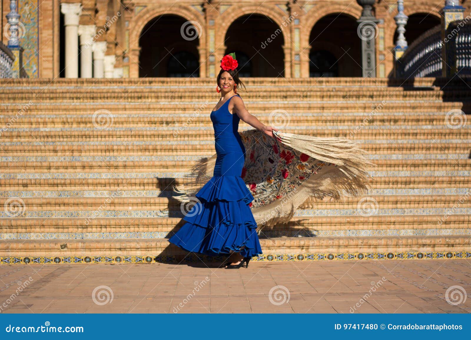 the woman with the blue dress and the red bow dancing