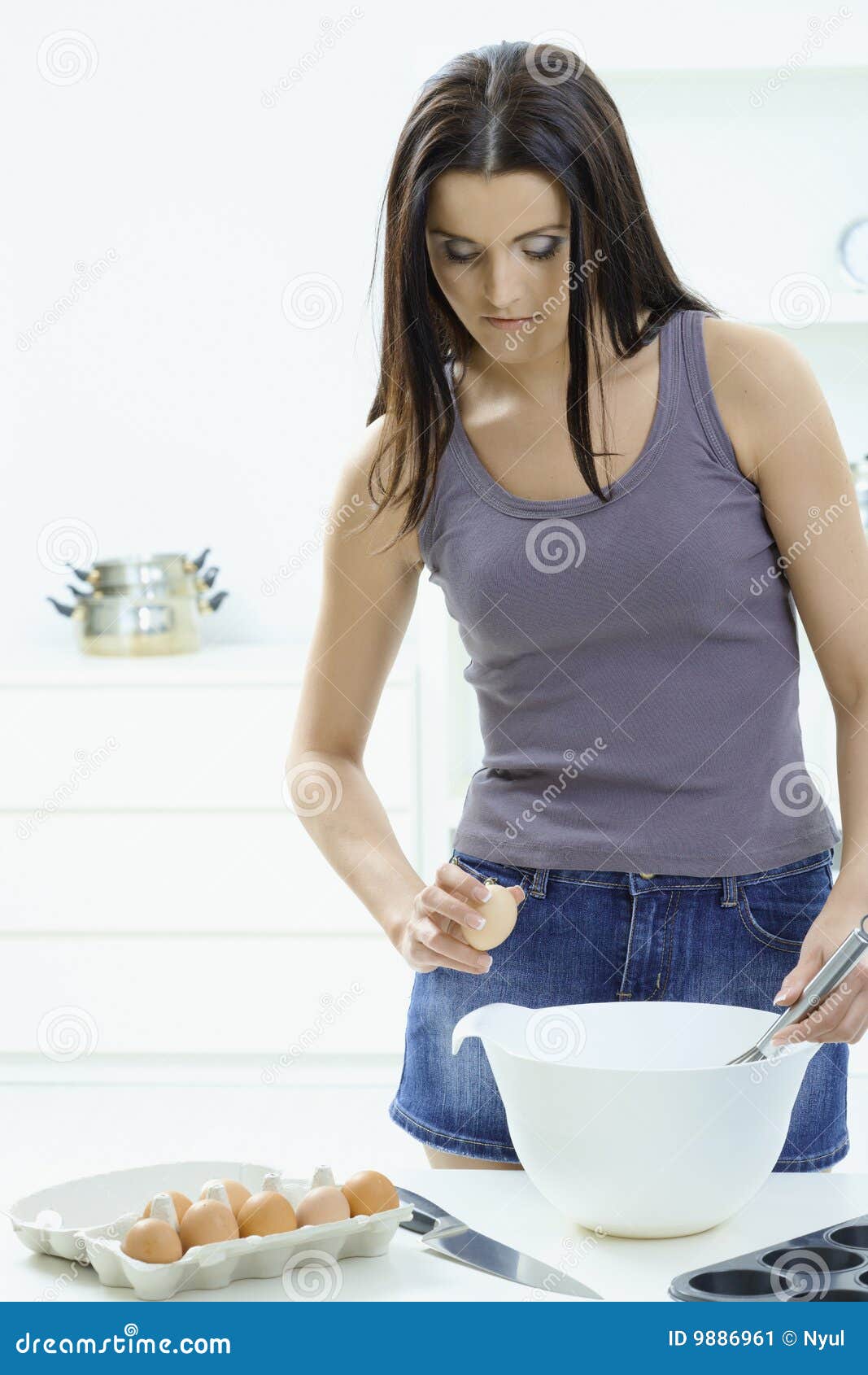 Woman Breaking Eggs in Kitchen Stock Image Image of bake, break 9886961