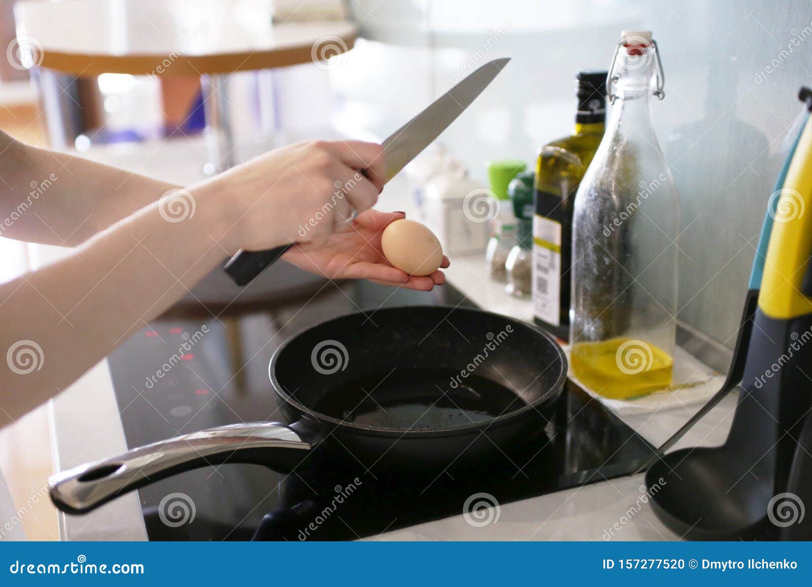 Woman Breaks an Egg into the Pan Stock Photo Image of metal, dish