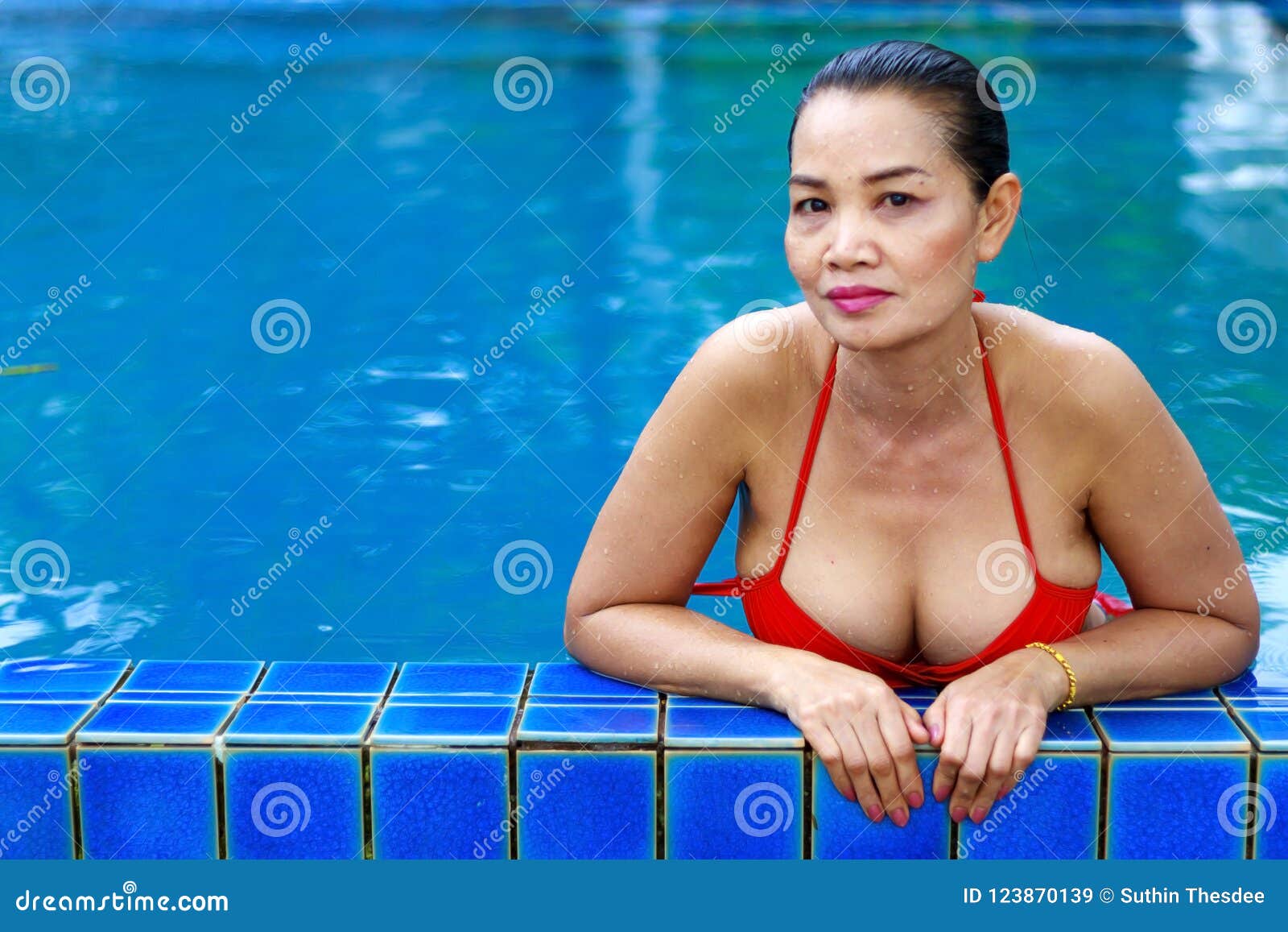 Woman Breast Beautiful with Red Bikini at Swimming Pool Stock