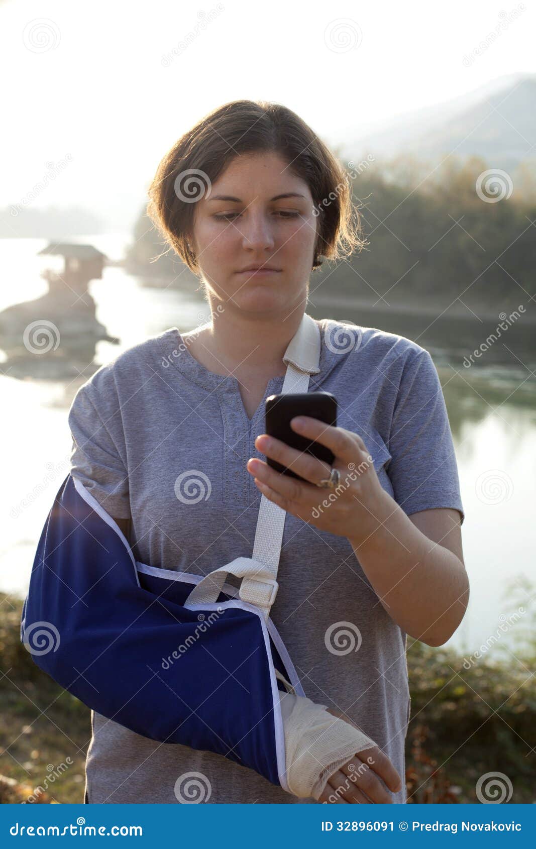 Woman with a Broken Arm and Smart Phone Stock Image Image of gauze, phone 32896091