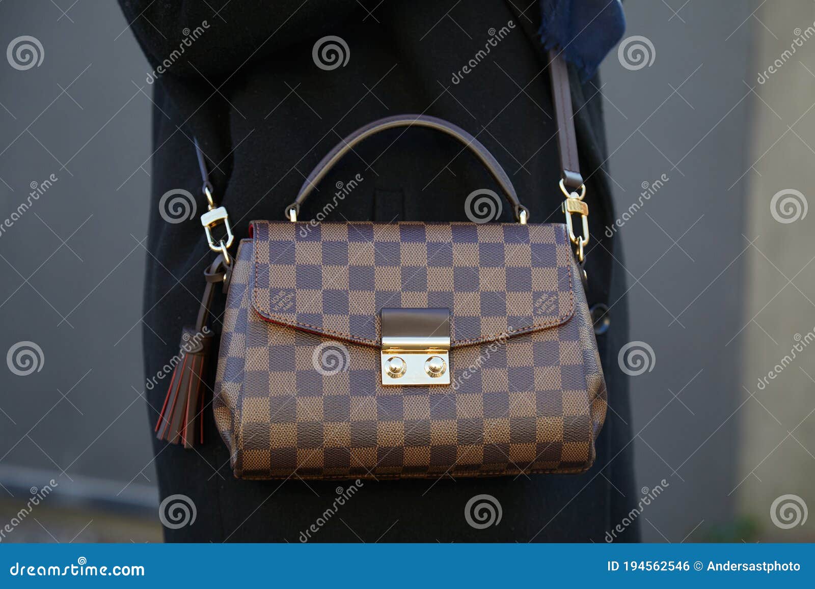 Woman with Brown Checkered Louis Vuitton Bag before Diesel Black