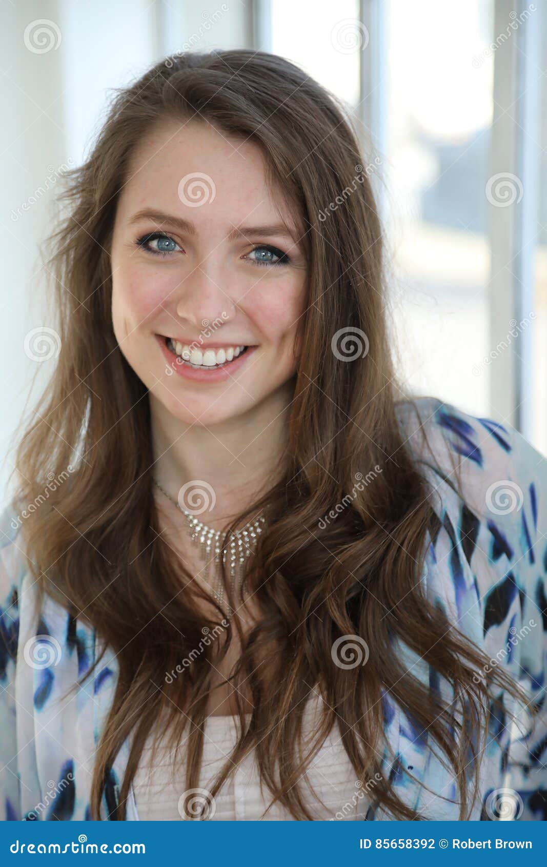 Woman With Brown Hair And Beautiful Blue Eyes Stock Photo ...