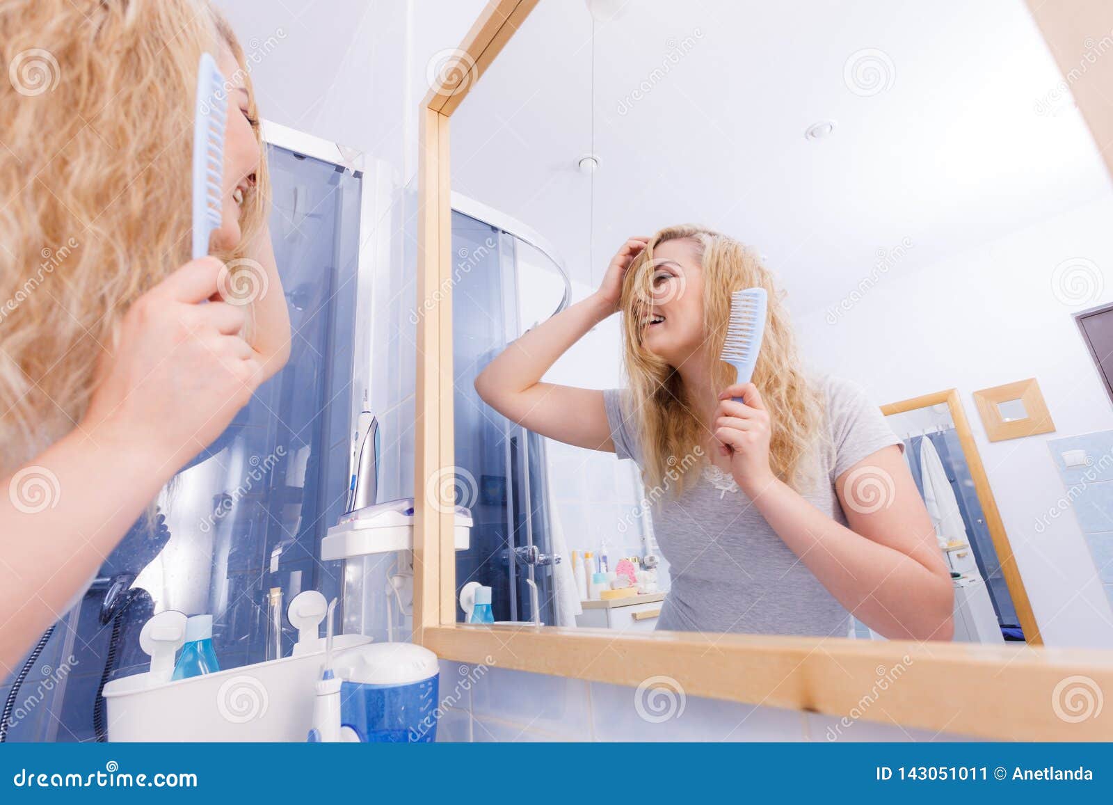 Woman Brushing Her Wet Blonde Hair Stock Image I