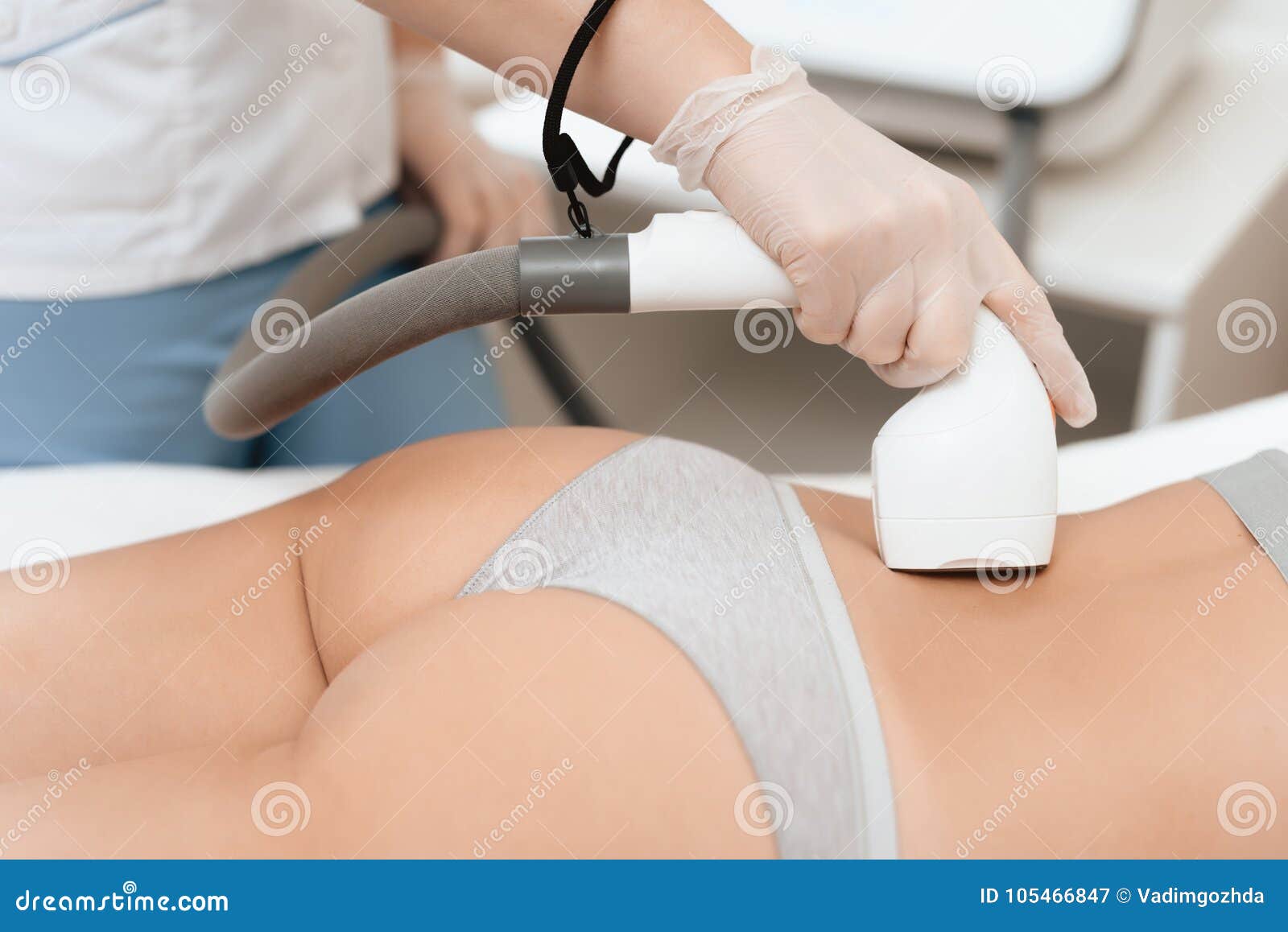 The Woman Came To the Procedure of Laser Hair Removal. the Doctor Treats Her Lower Back with a Device Stock Image - Image of beauty, people: 105466847 The Woman Came To the Procedure of Laser Hair Removal. the Doctor Treats Her Lower Back with a Device Stock Image - Image of beauty, people: 105466847
