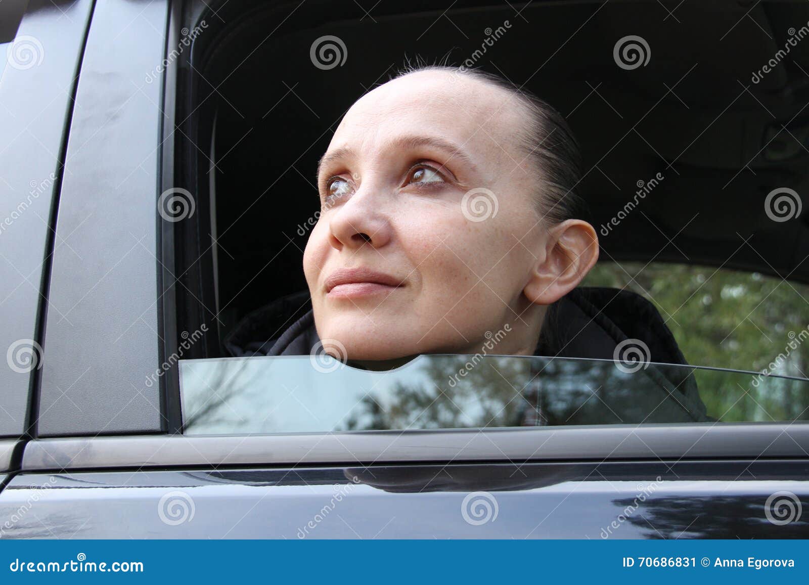 A woman in a car stock image. Image of looking, head 70686831