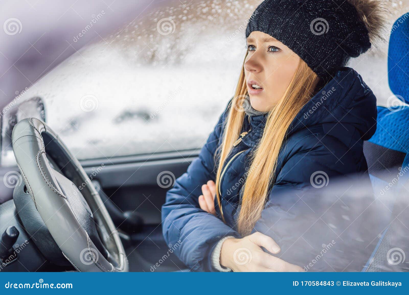 Woman in a Car during a Snowfall, Problems on the Road Stock Image