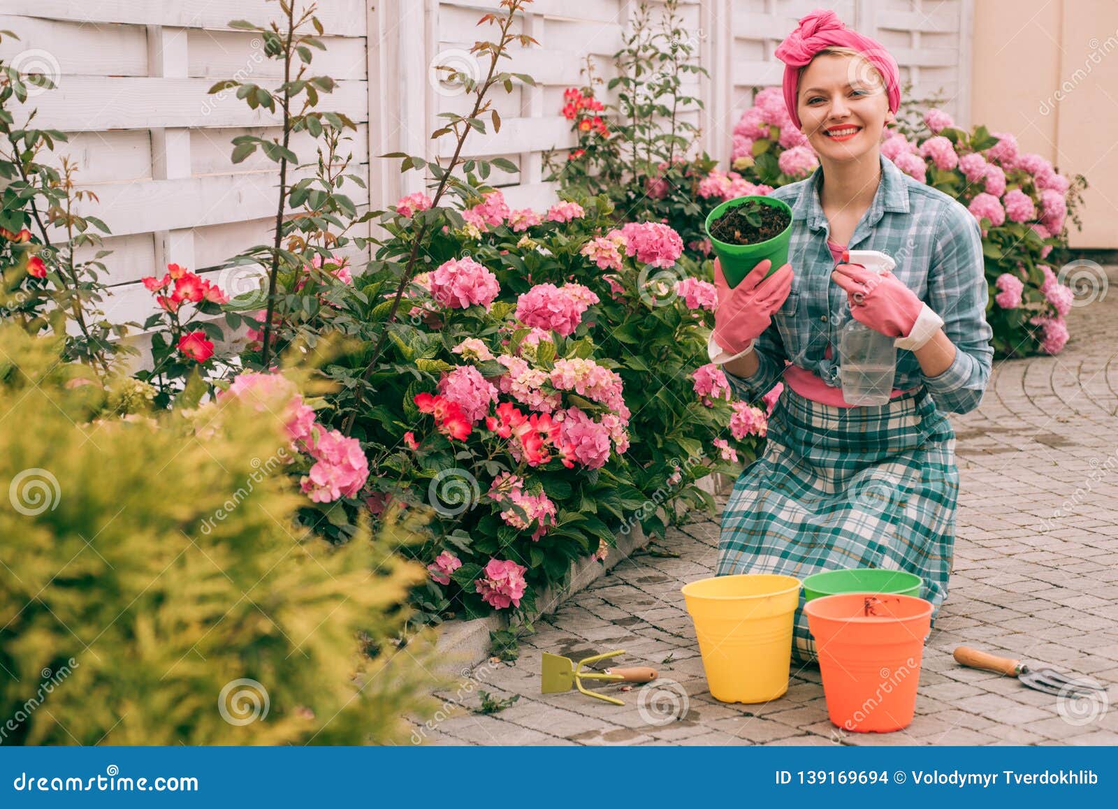 Woman Care Of Flowers In Garden Happy Woman Gardener With Flowers