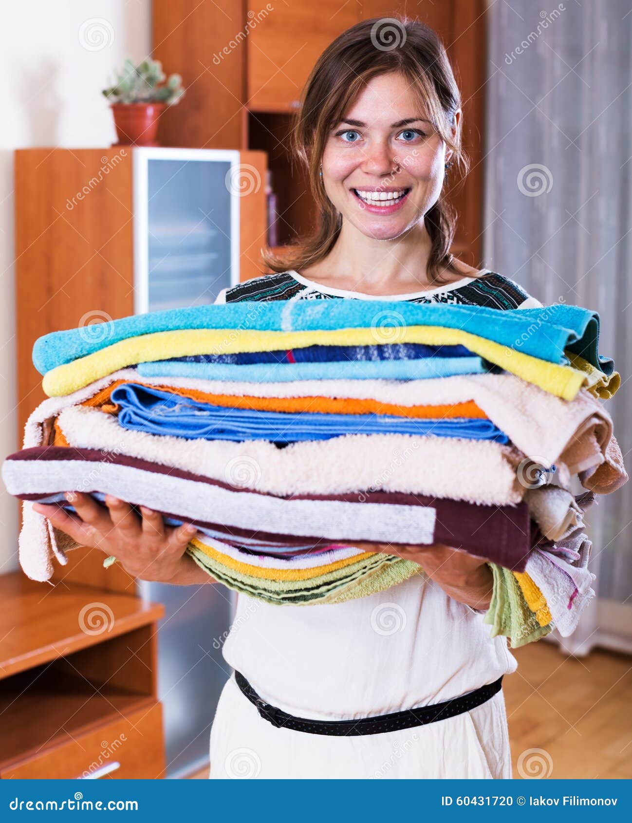 Woman Carrying Laundry To Iron Stock Photo - Image of girl, bottle ...