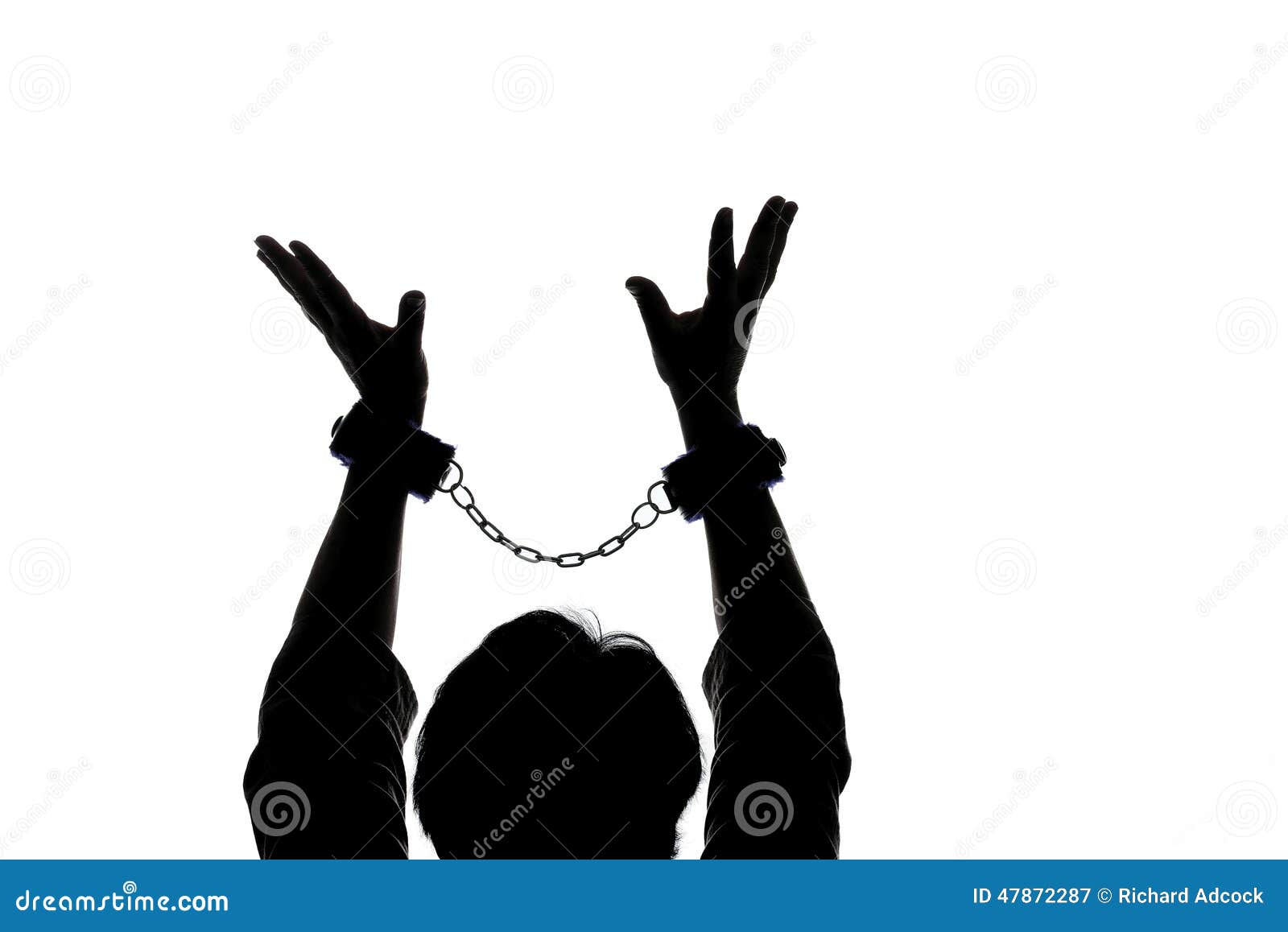 Girl in handcuffs and mask. in color lights. tied hands and