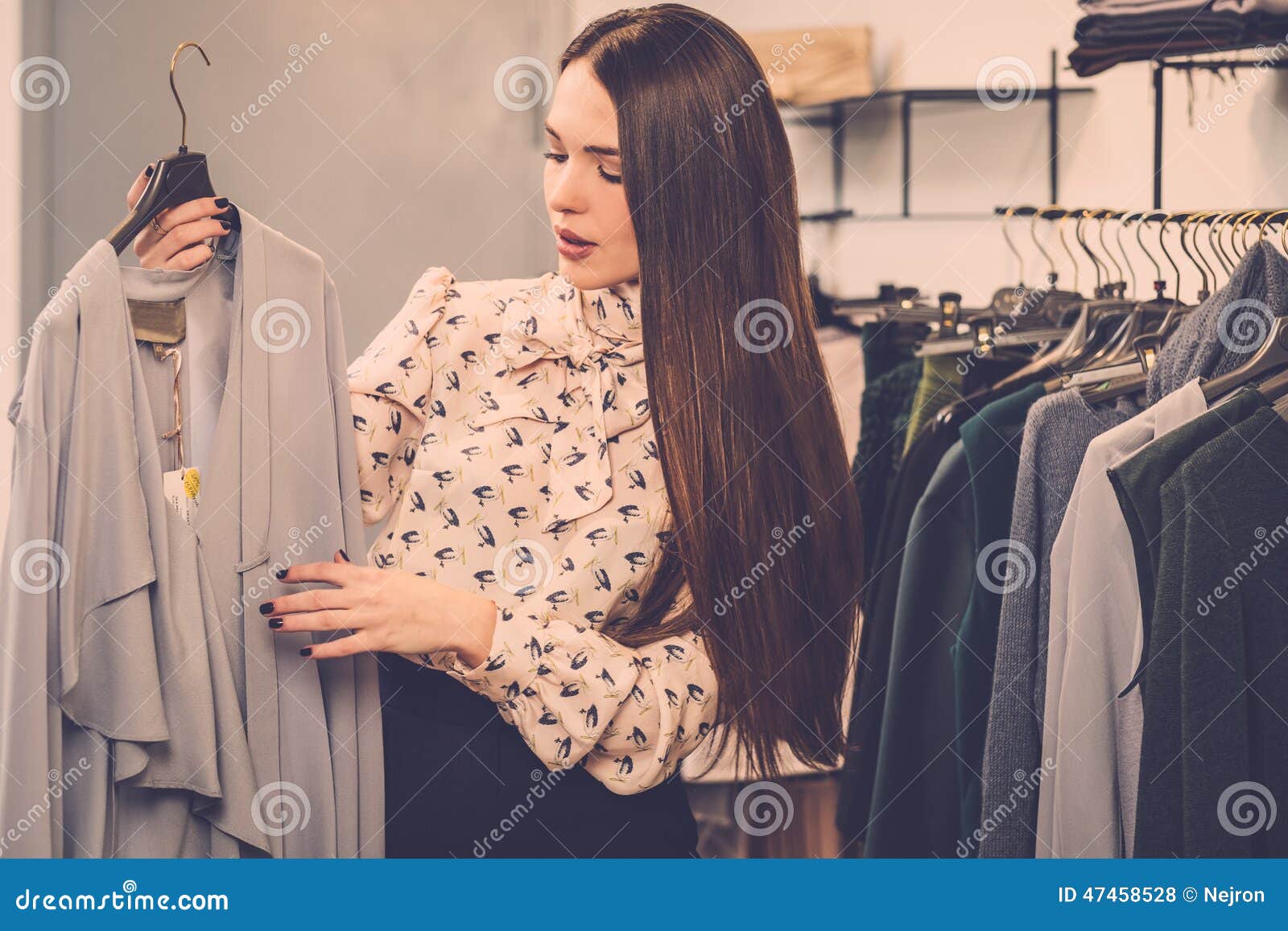 Woman Choosing Clothes a Showroom Stock Photo - Image of changing ...