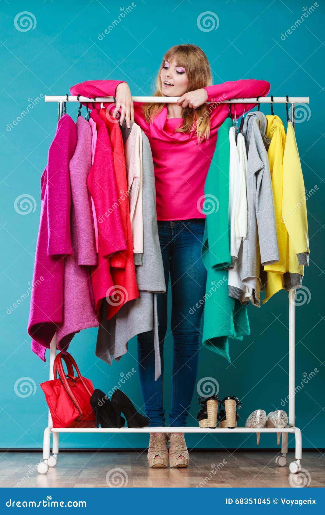 Woman Choosing Clothes To Wear in Mall or Wardrobe Stock Image - Image ...