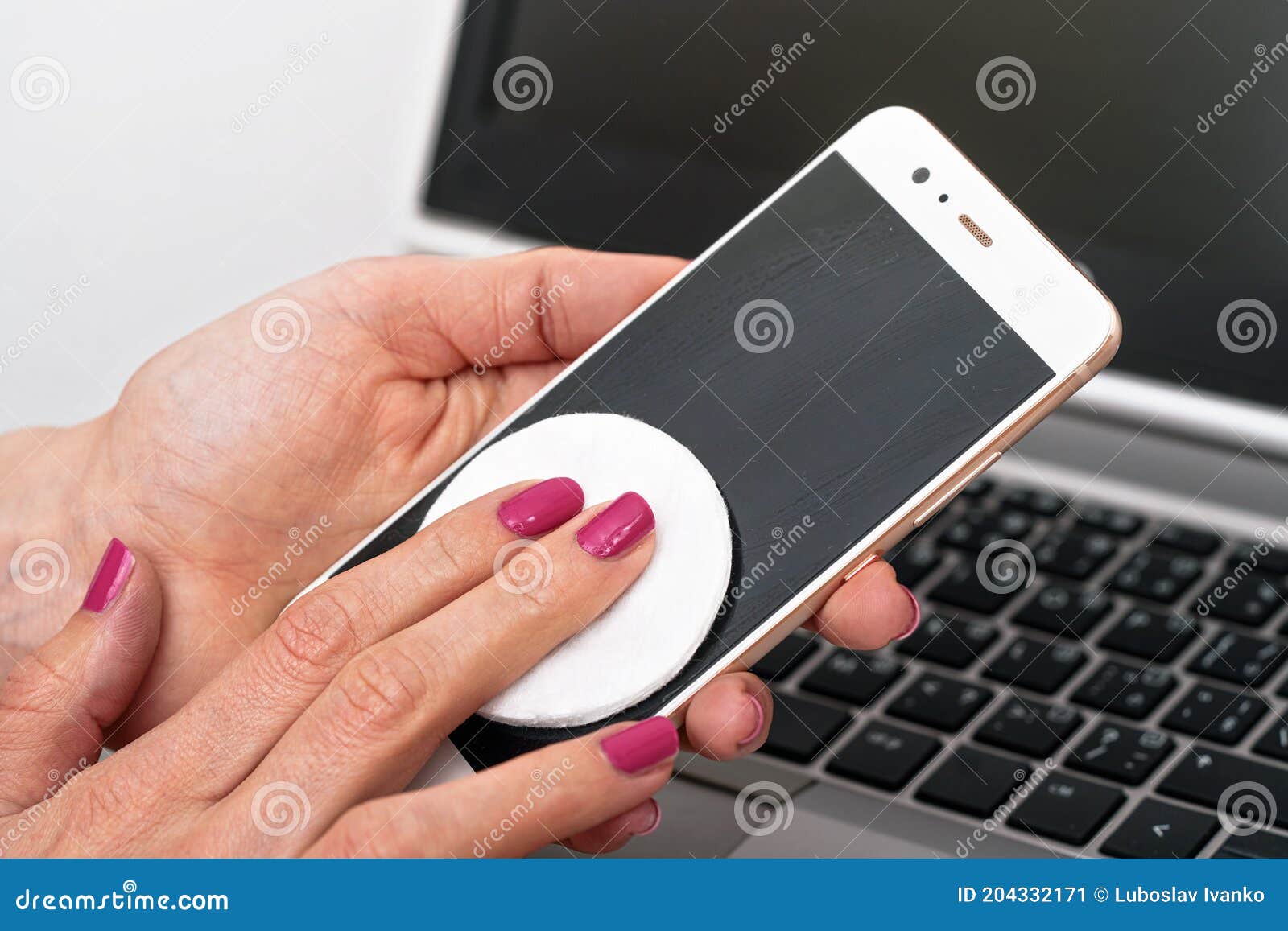 Woman Cleaning Mobile Phone with Cotton Paper Pad, Wiping Black