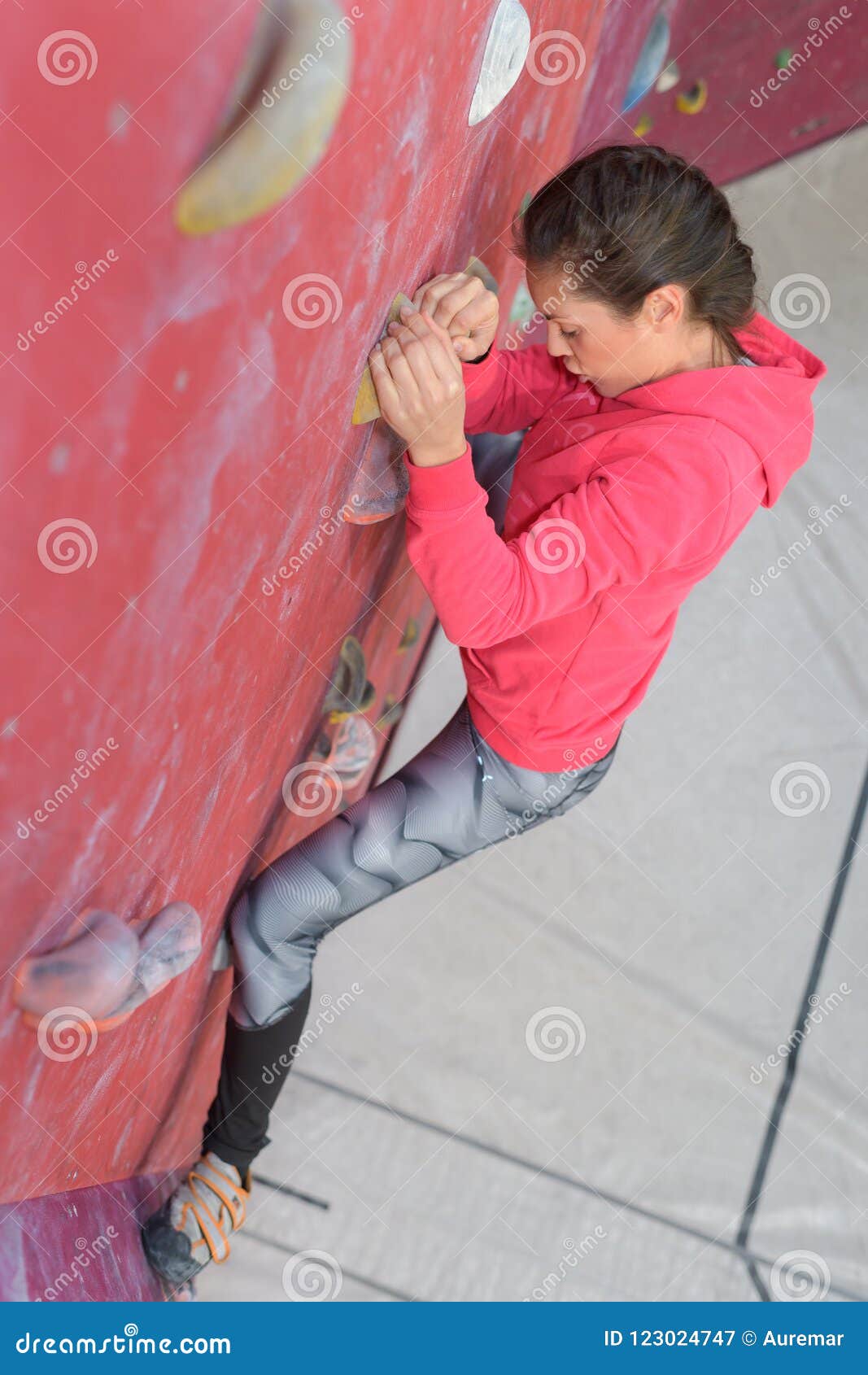 Woman climbing the wall stock image. Image of surface 123024747