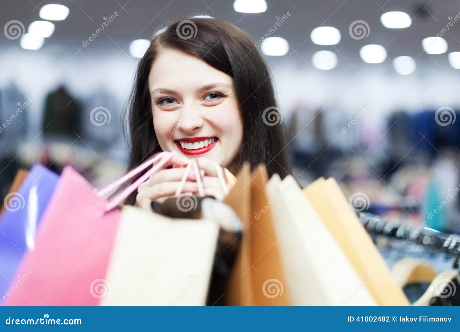 Woman at clothing boutique stock photo. Image of shopaholic - 41002482