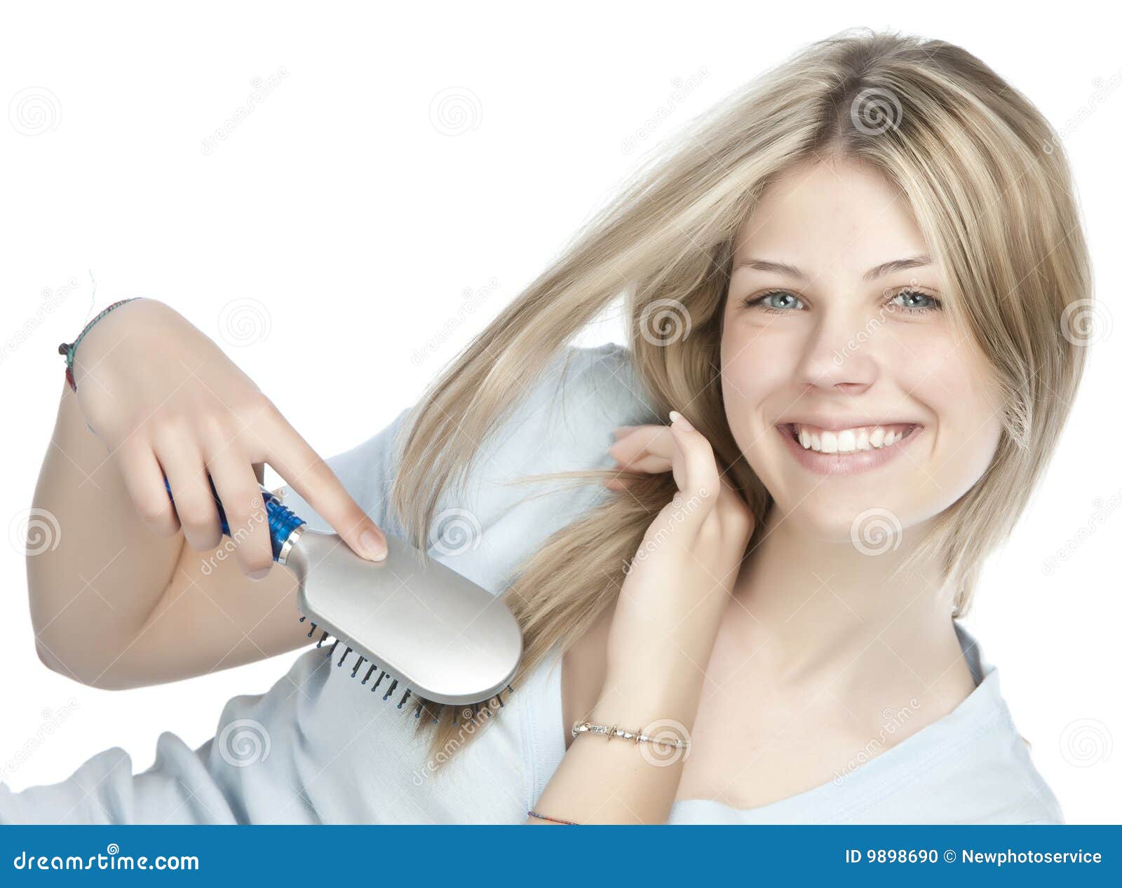 Woman combing her hair stock photo. Image of beauty, blonde 9898690