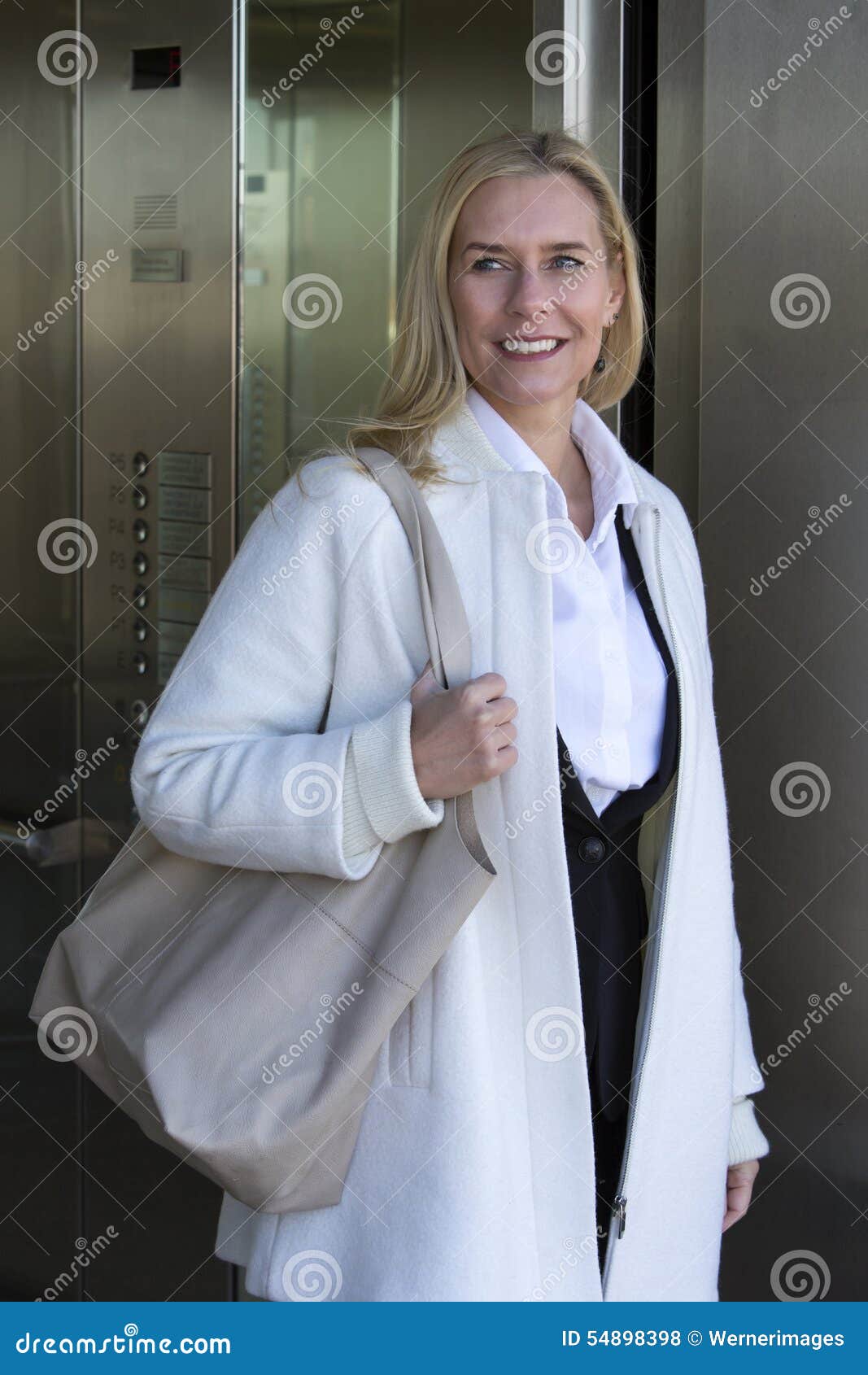 Woman Coming Out of an Elevator Stock Photo Image of shopping, purse 54898398