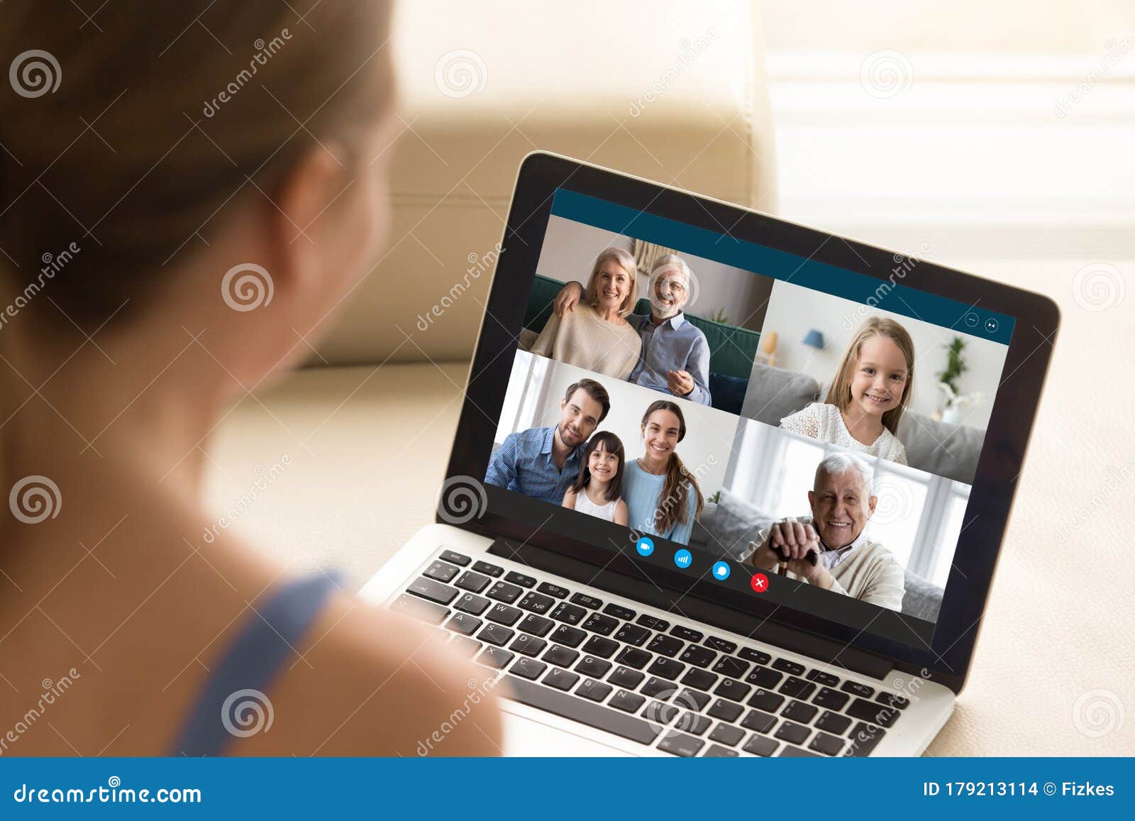 woman communicating with family using laptop and videoconference application