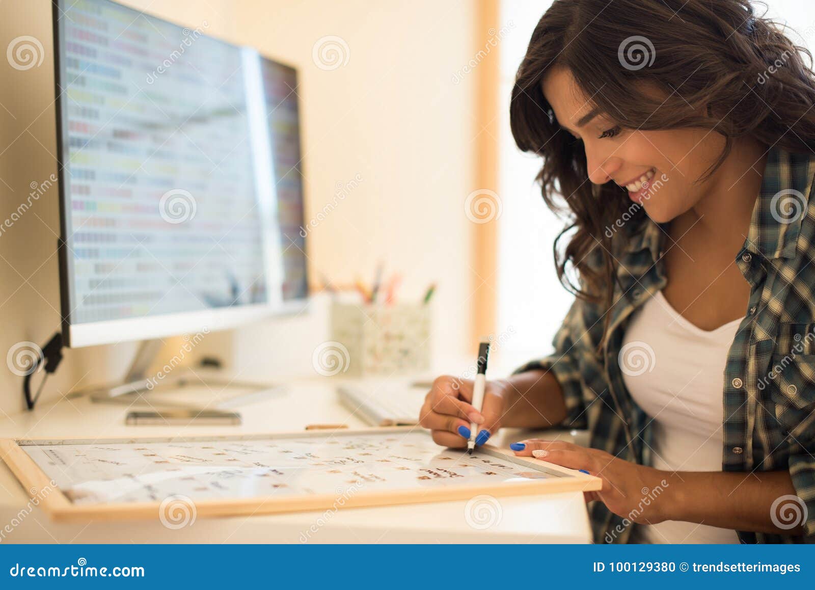 Woman writing on calendar stock photo Image of hipster 100129380 Woman writing on calendar stock photo Image of hipster 100129380