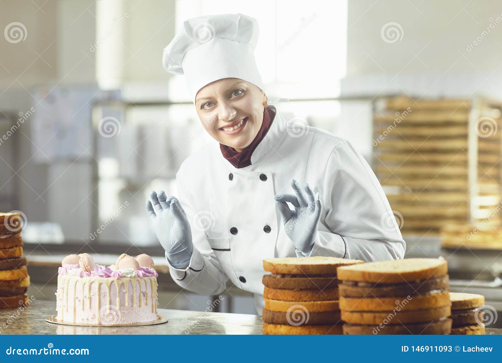 pastry chef girl, baker holds whisk in her hands, cooked cake on