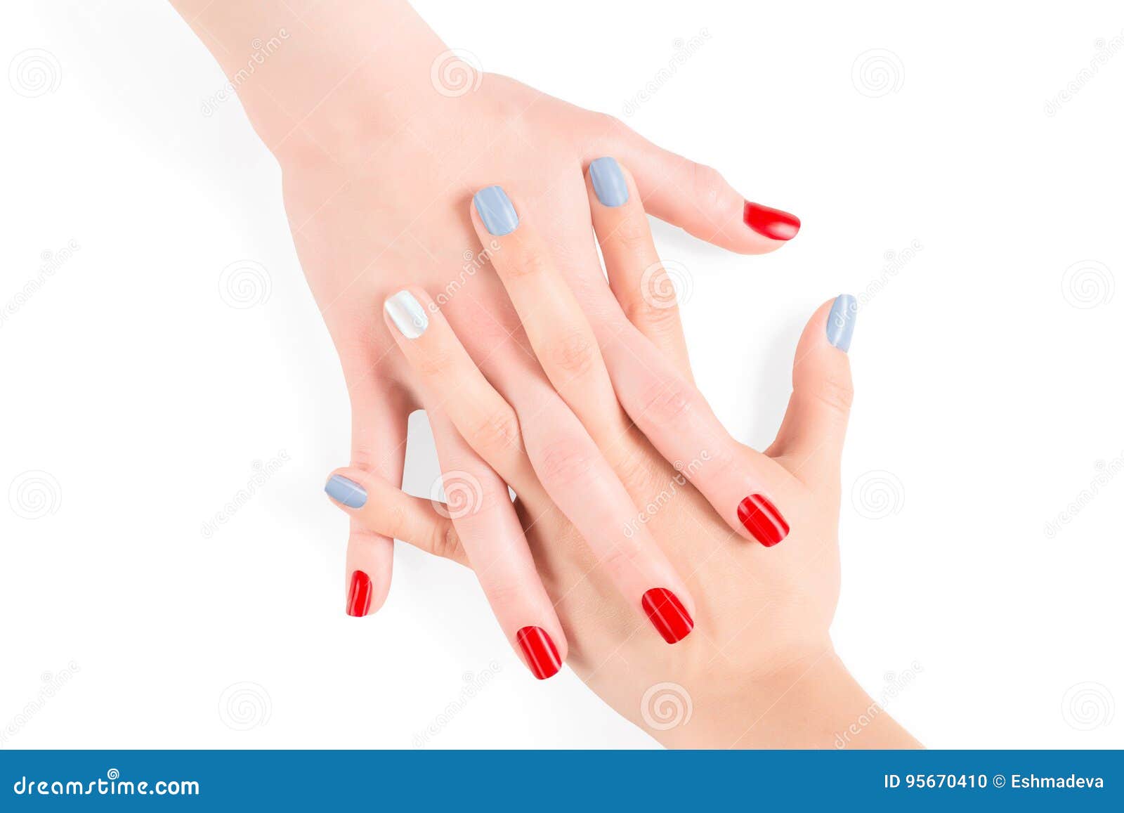 woman connected hands with red and blue shellac nail polish