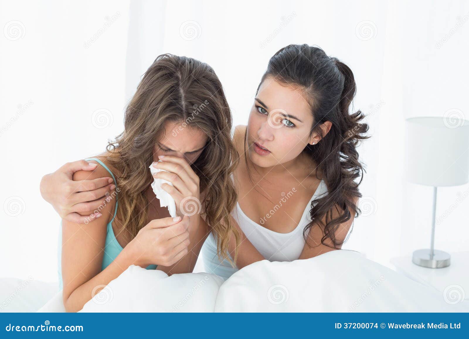 woman-consoling-crying-female-friend-bed-young-women-sitting-home-37200074.jpg