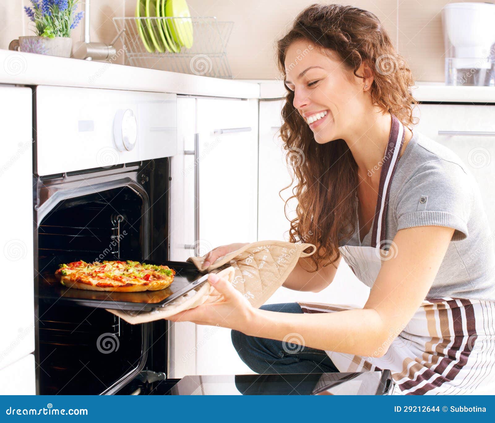 woman cooking pizza