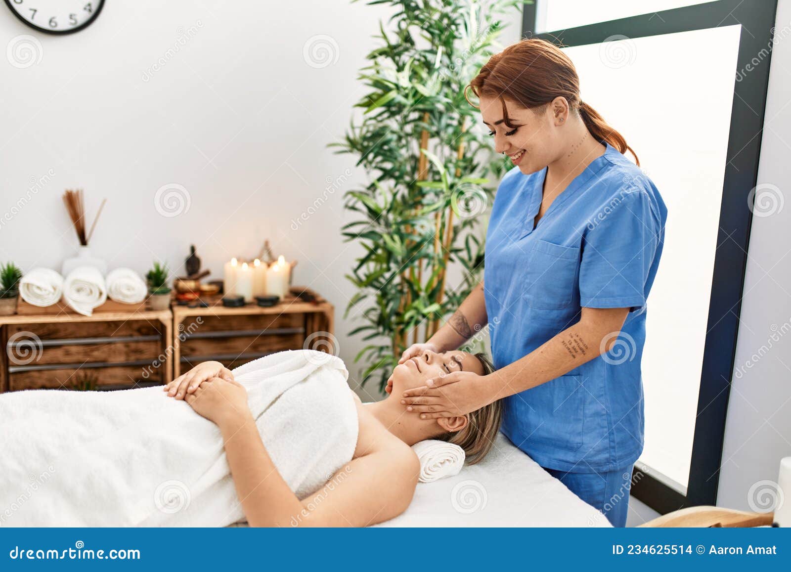 woman couple smiling confident having facial massage at beauty center