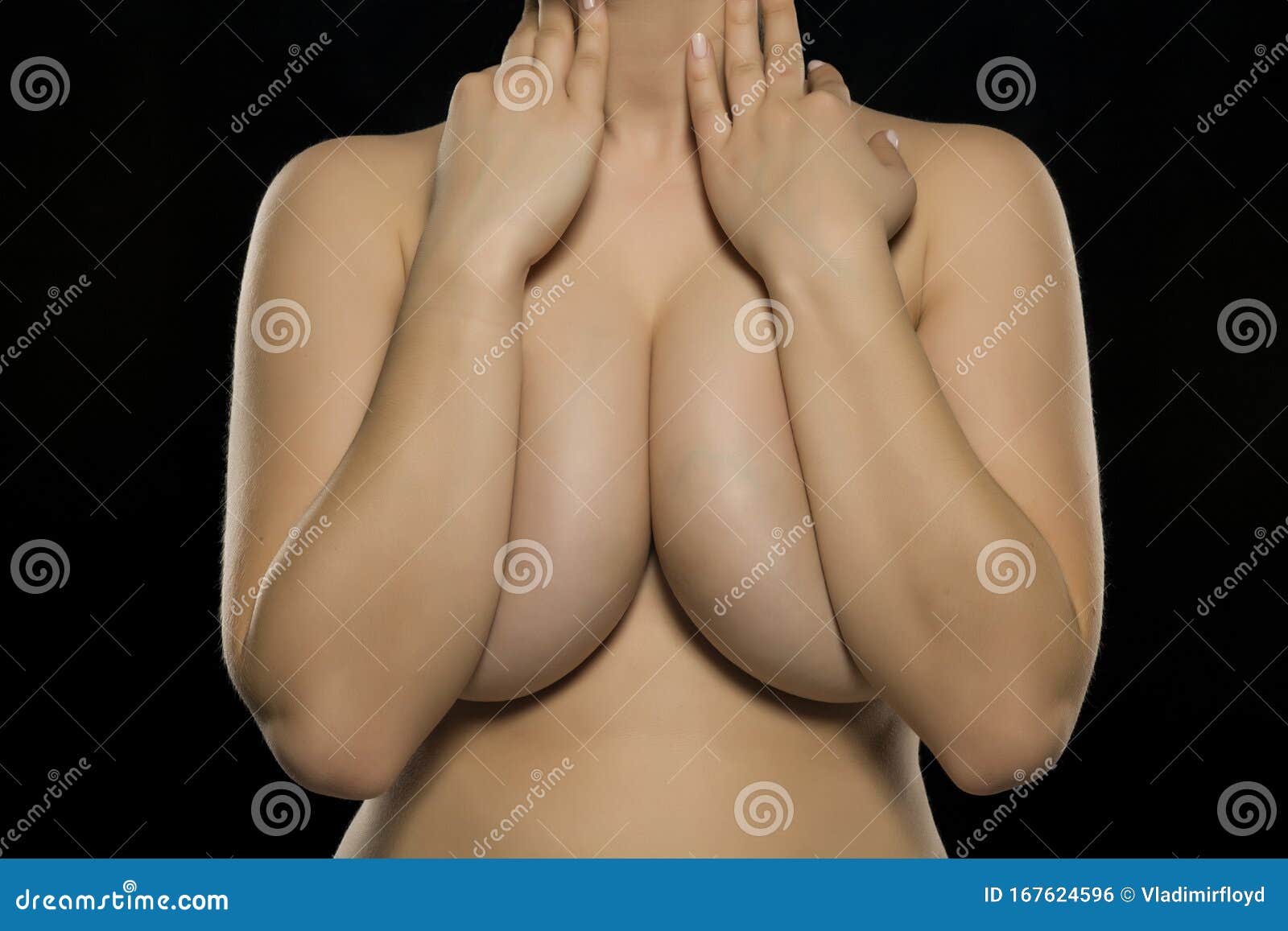 Woman Covering Her Big Breasts with Her Hands Stock Photo - Image