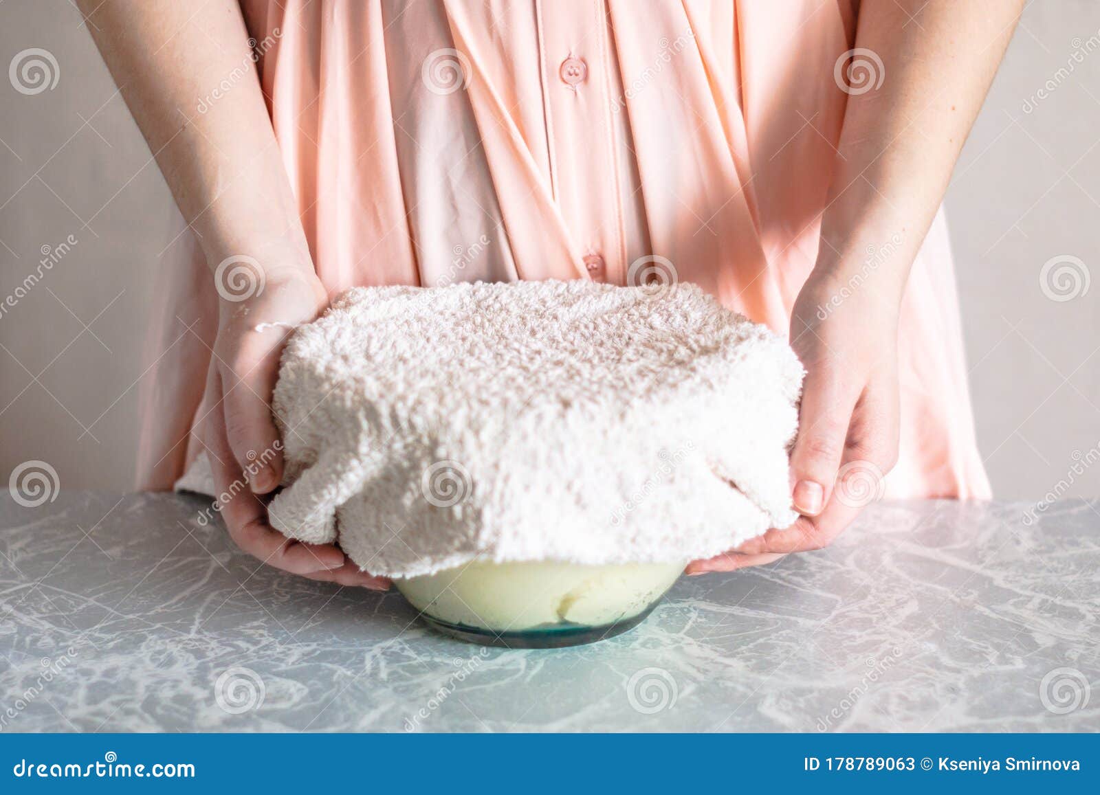 The Woman Covers the Dough in a Bowl with a Towel. Stock Image Image