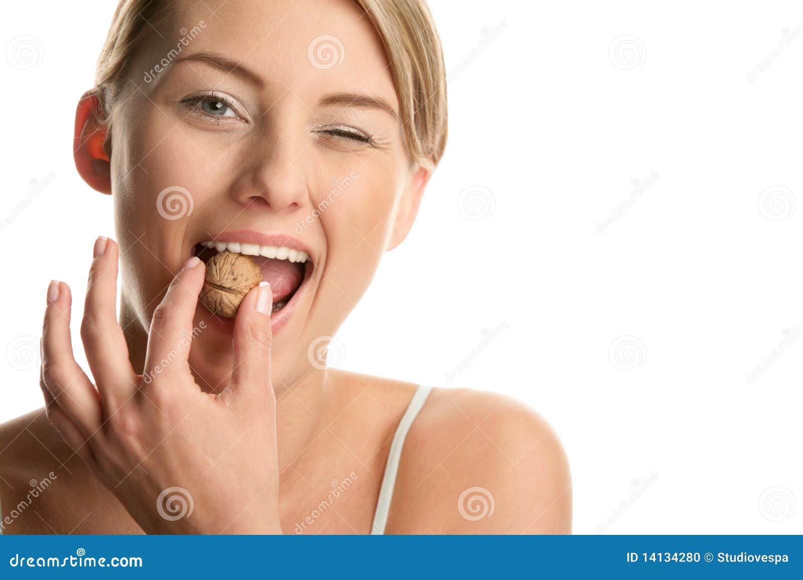 woman cracking walnut